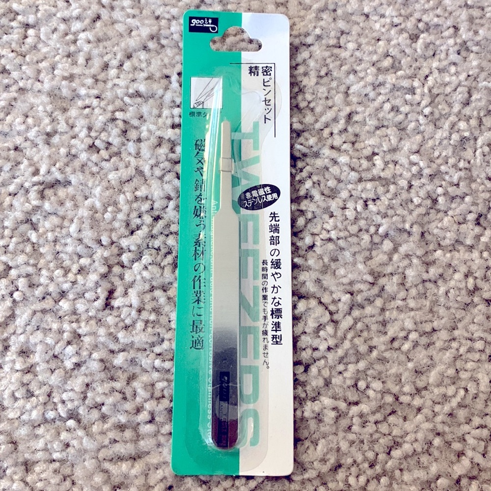 Small tweezers - never opened